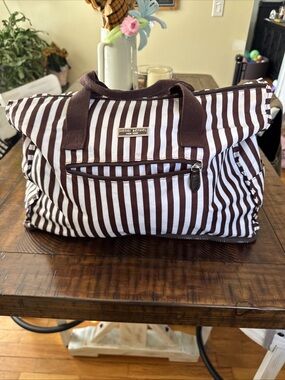 Henri Bendel Brown stripe Nylon Weekender bag w/silver hardware that is preowned